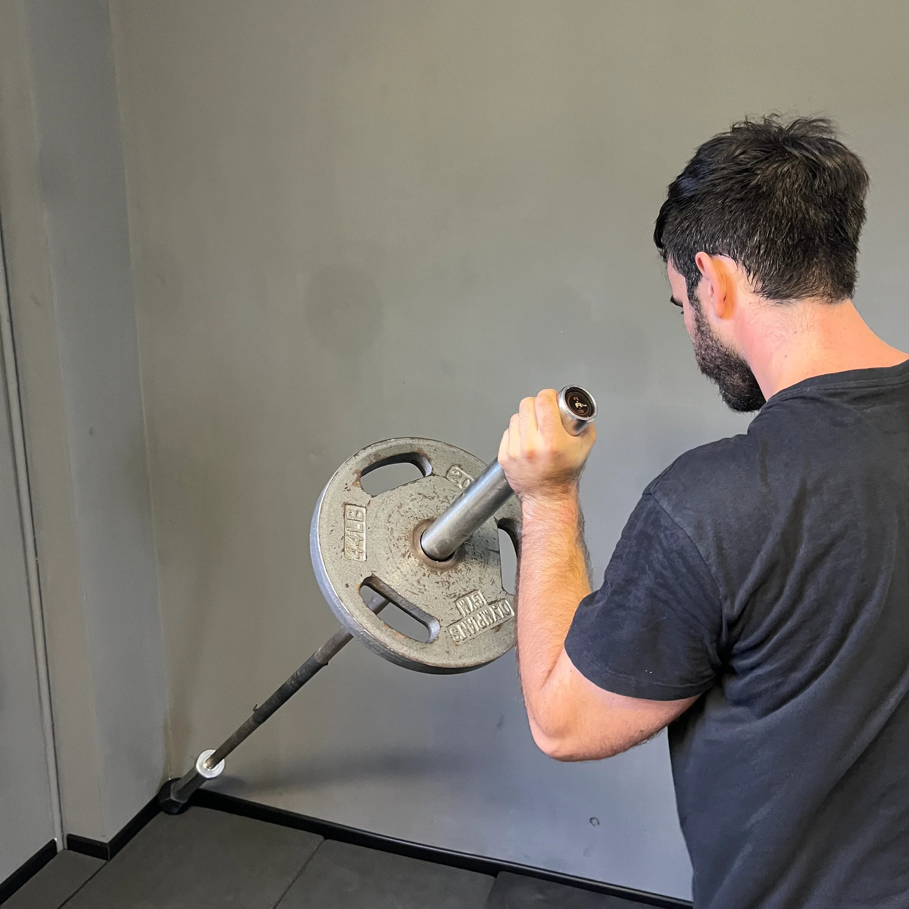 Landmine mounted to power rack in home gym